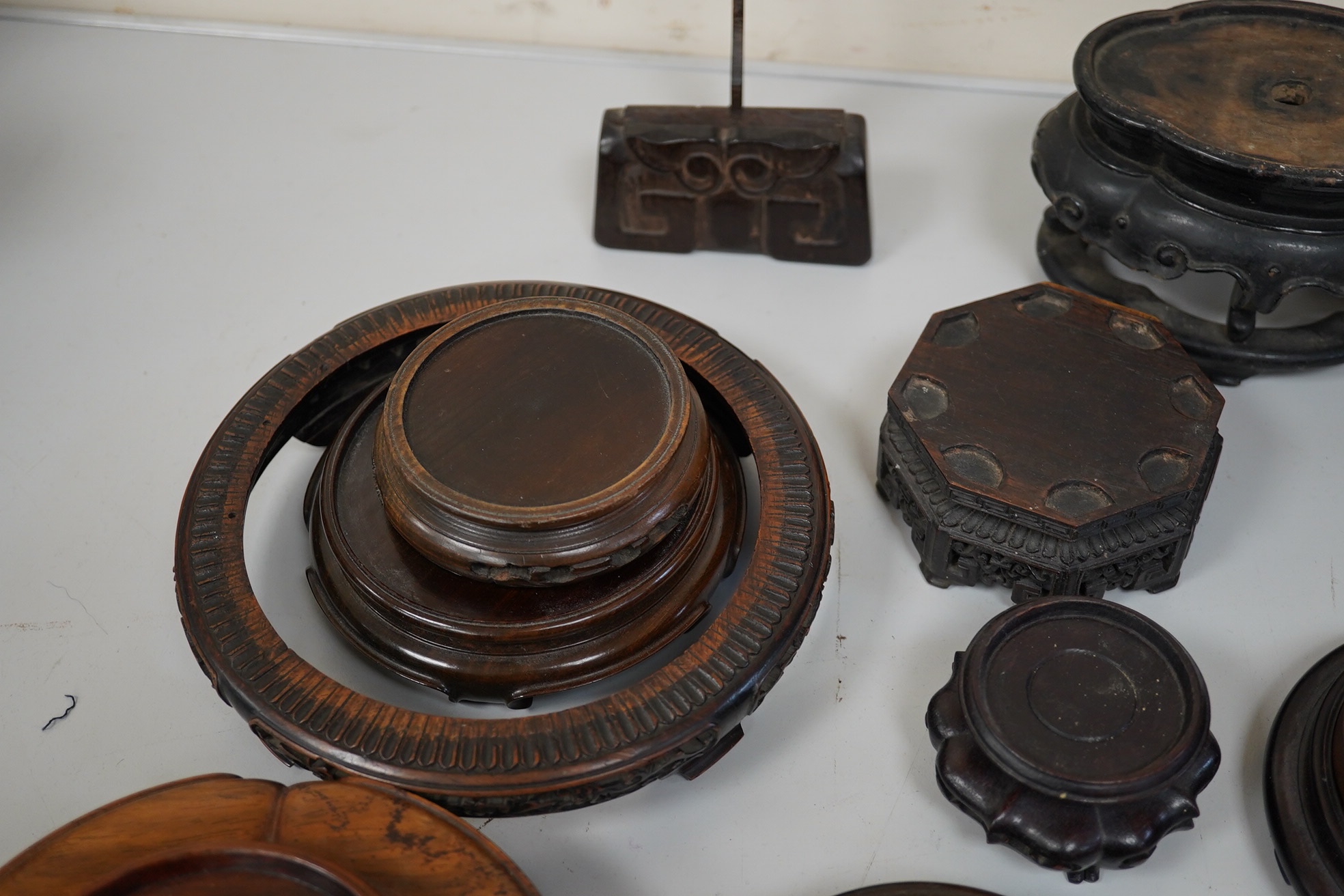 A group of 19th century and later Chinese hardwood stands, largest 18cm in diameter. Condition - mostly fair to good